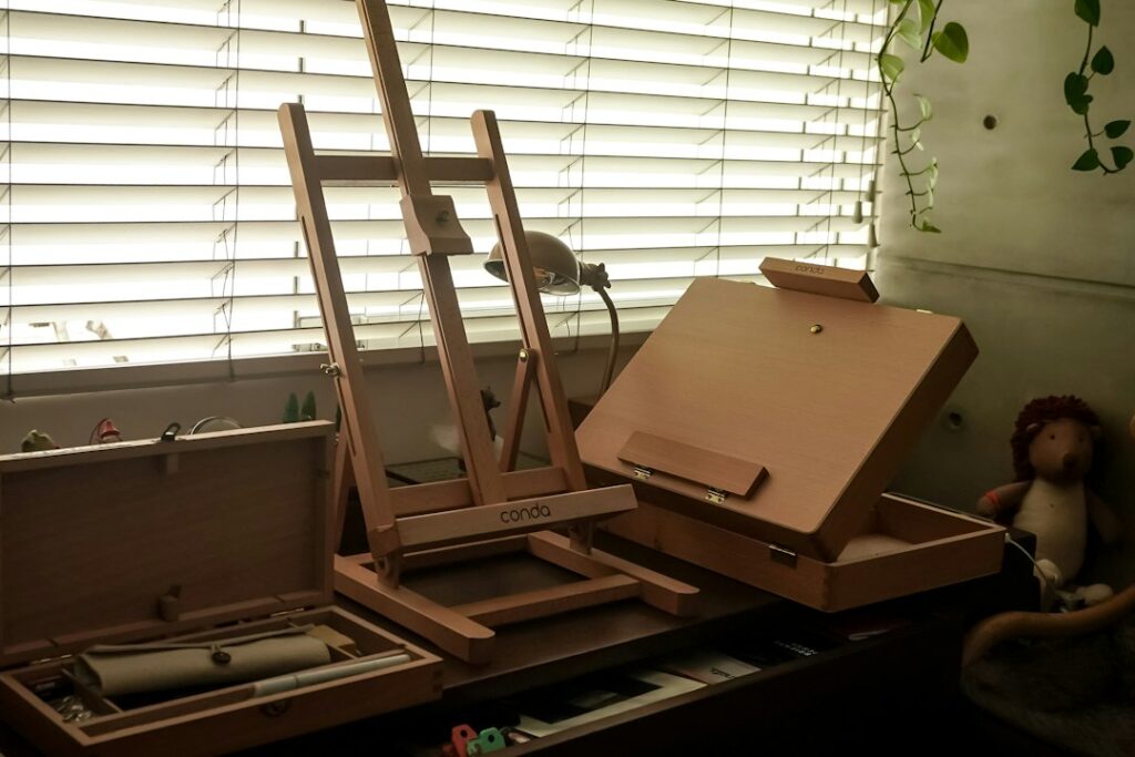 Artist's easel and painting supplies in a quiet studio, the kind of dedicated workspace an artist residency provides