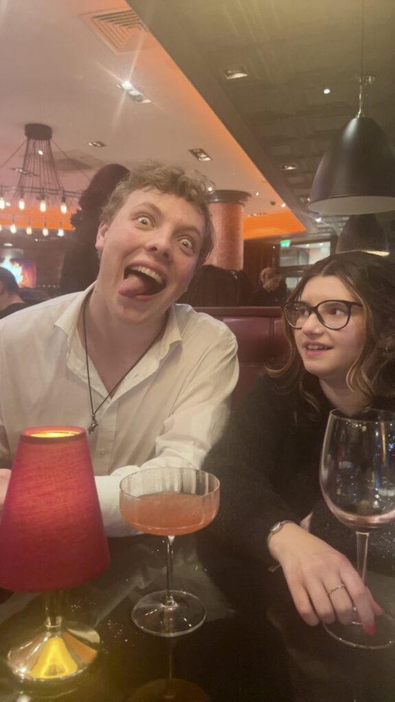 James Carter pulling a funny face over cocktails in Covent Garden, London