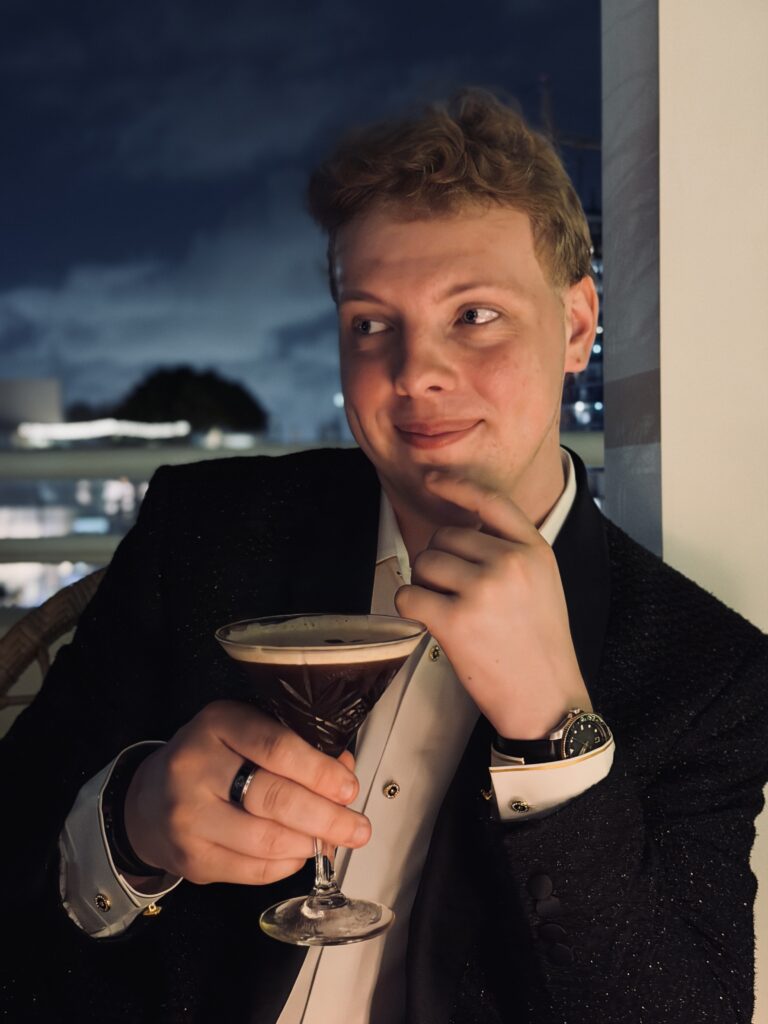 Portrait of James Carter with an espresso martini in Miami