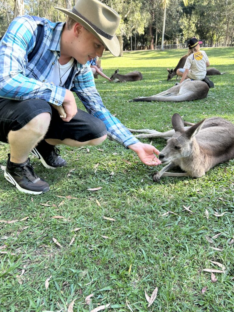 James Carter feeding a kangaroo at Australia Zoo