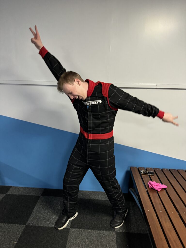 James Carter in a race suit at go karting