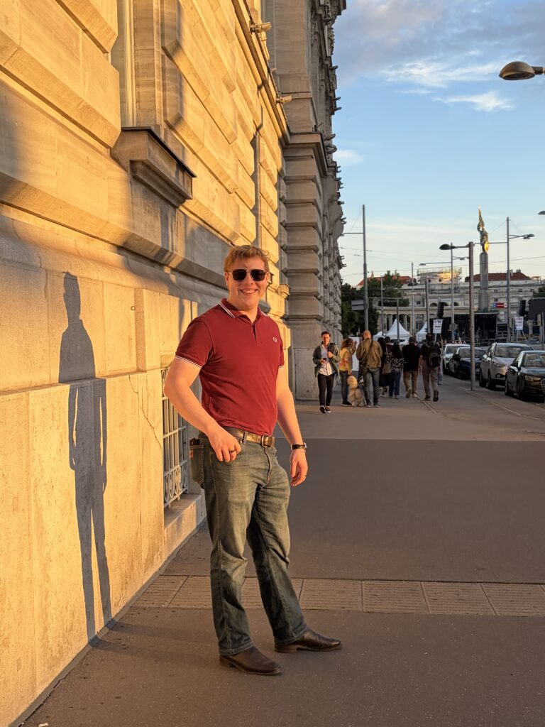 James Carter on a street in Vienna at golden hour