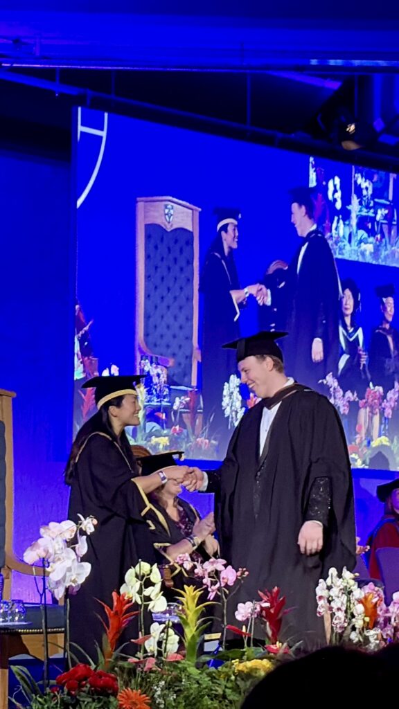 James Carter on stage at his Goldsmiths graduation ceremony