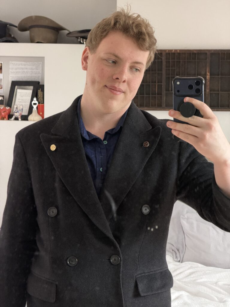 James Carter in a double breasted coat