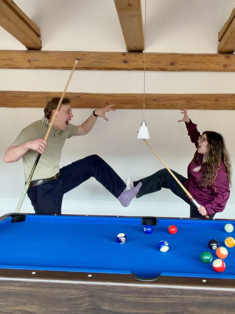 James Carter playing pool in a Swiss chalet