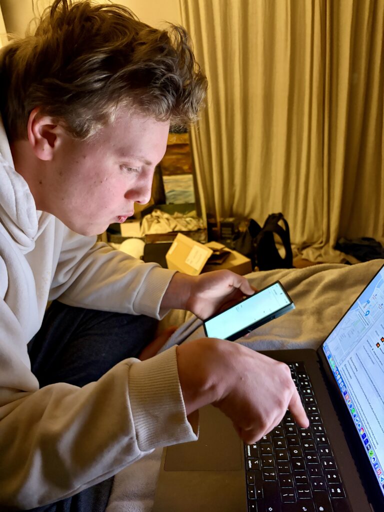 James Carter working late on his laptop