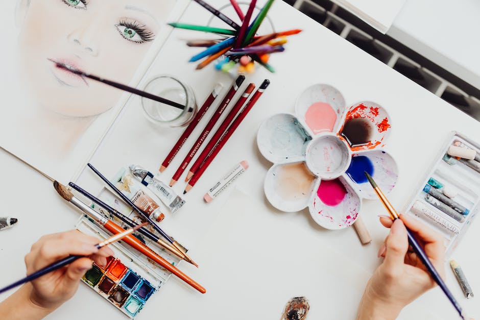An image depicting various art supplies, including paintbrushes, paints, and a sculpture, representing the essence of creativity and the artistic process.